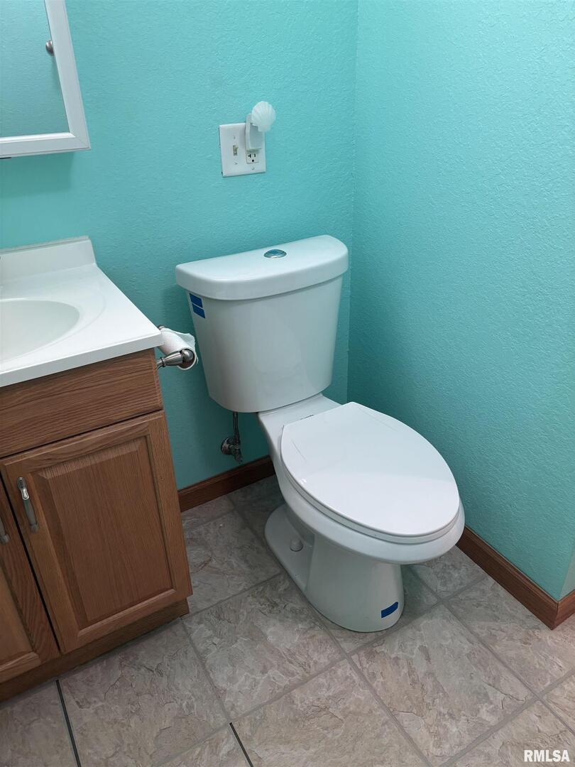 418 East Division Street Kewanee, IL 61443 - Photo 66 of 72 a white toilet sitting next to a bathroom sink