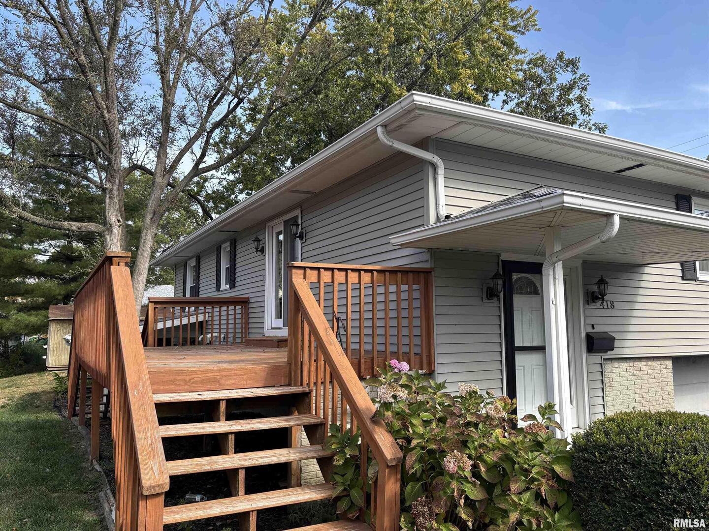 418 East Division Street Kewanee, IL 61443 - Photo 7 of 72 a front view of a house with a garden