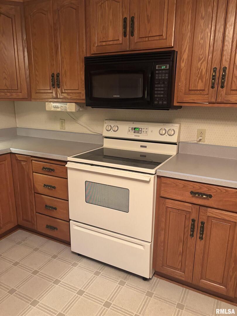 418 East Division Street Kewanee, IL 61443 - Photo 8 of 72 a kitchen with granite countertop cabinets stainless steel appliances and a sink
