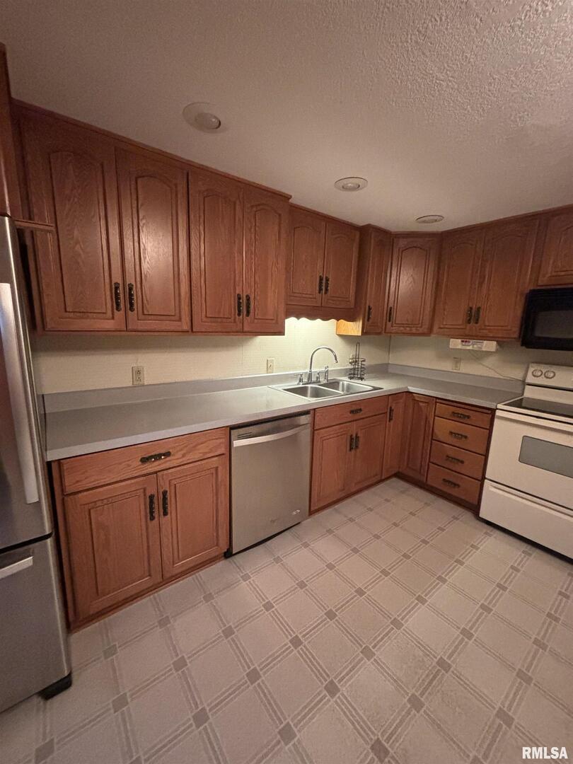 418 East Division Street Kewanee, IL 61443 - Photo 9 of 72 a kitchen with cabinets a sink and a stove