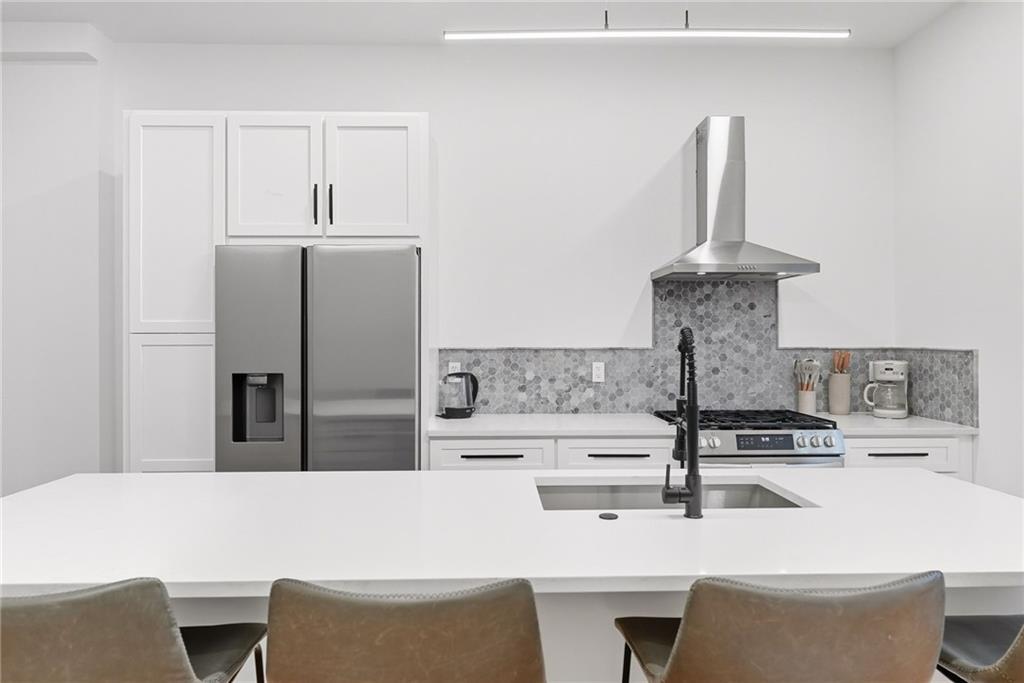 1236 Butterfield Way Pittsburgh, PA 15212 - Photo 16 of 40 a kitchen with stainless steel appliances kitchen island sink refrigerator and stove