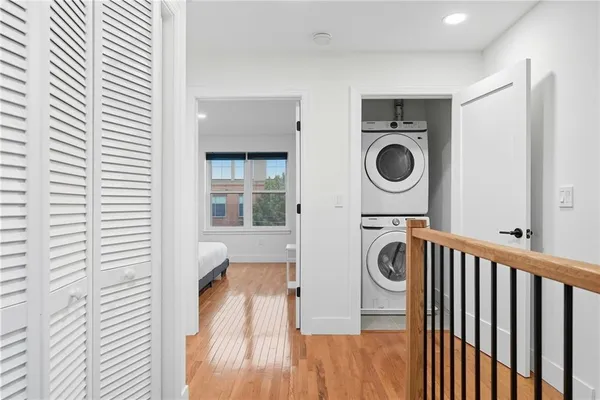 a view of a hallway with washer and dryer