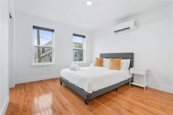 a bedroom with a bed and window