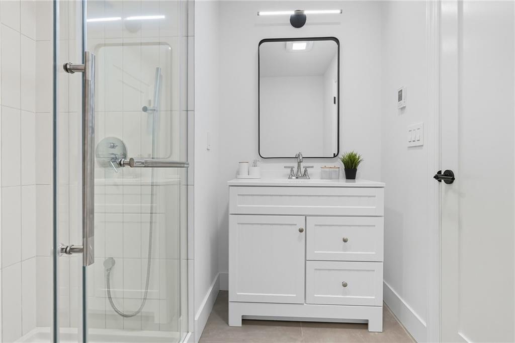 1236 Butterfield Way Pittsburgh, PA 15212 - Photo 36 of 40 a bathroom with a double vanity sink mirror and