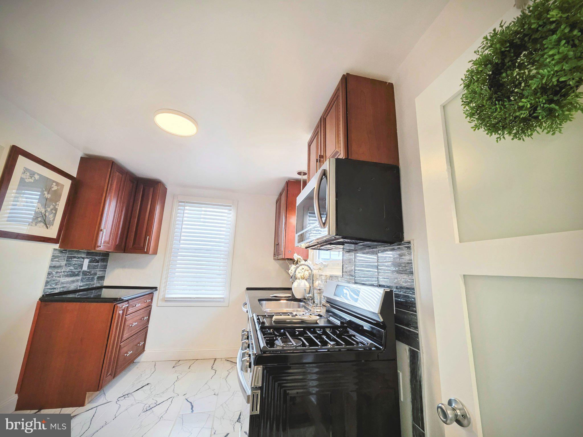 3712 West Cold Spring Lane Baltimore, MD 21215 - Photo 28 of 39 Modern kitchen with sleek finishes.