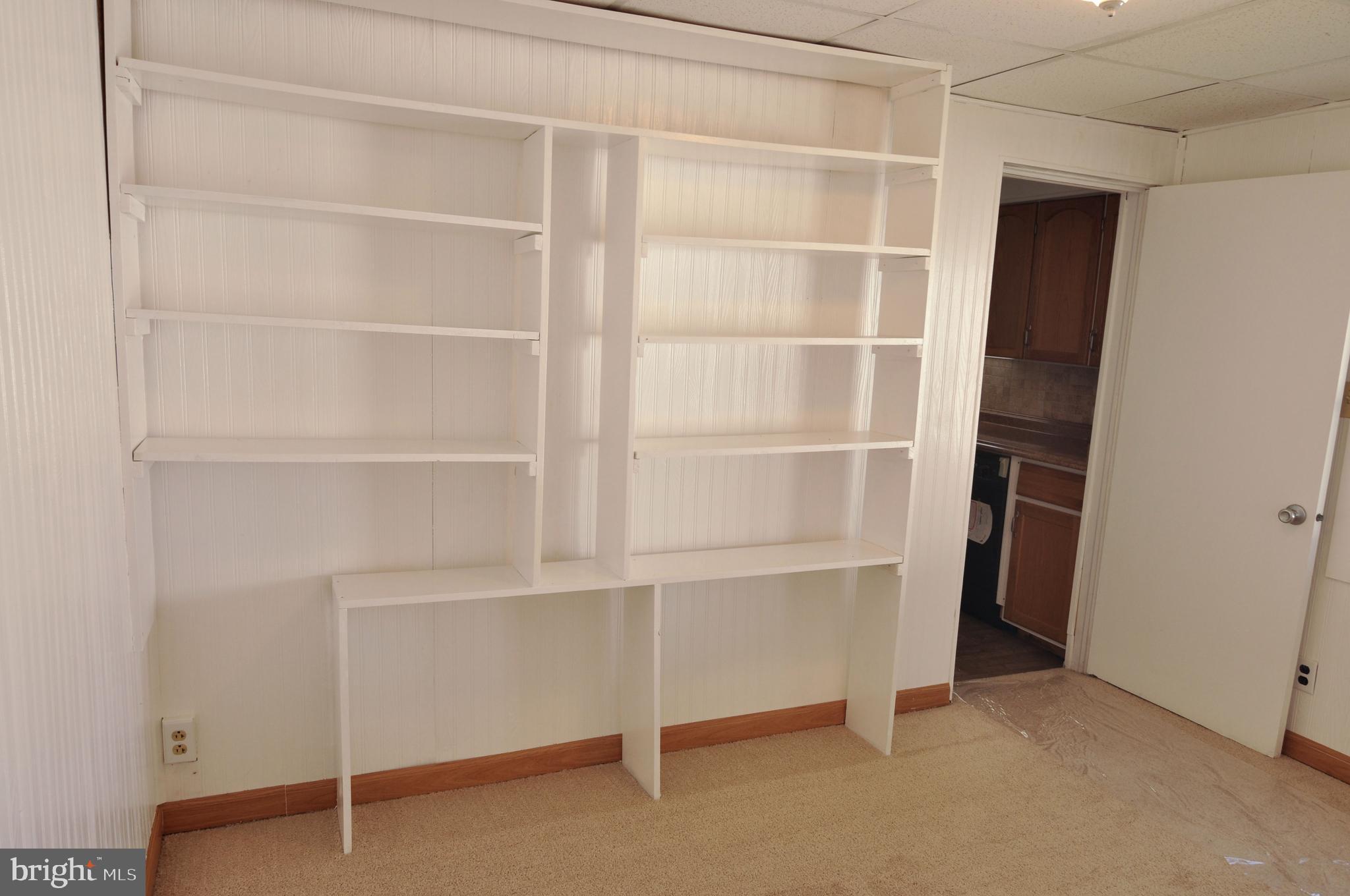 216 Clyde Avenue Baltimore, MD 21227 - Photo 30 of 64 Dining Room/Office/Built-in Shelves