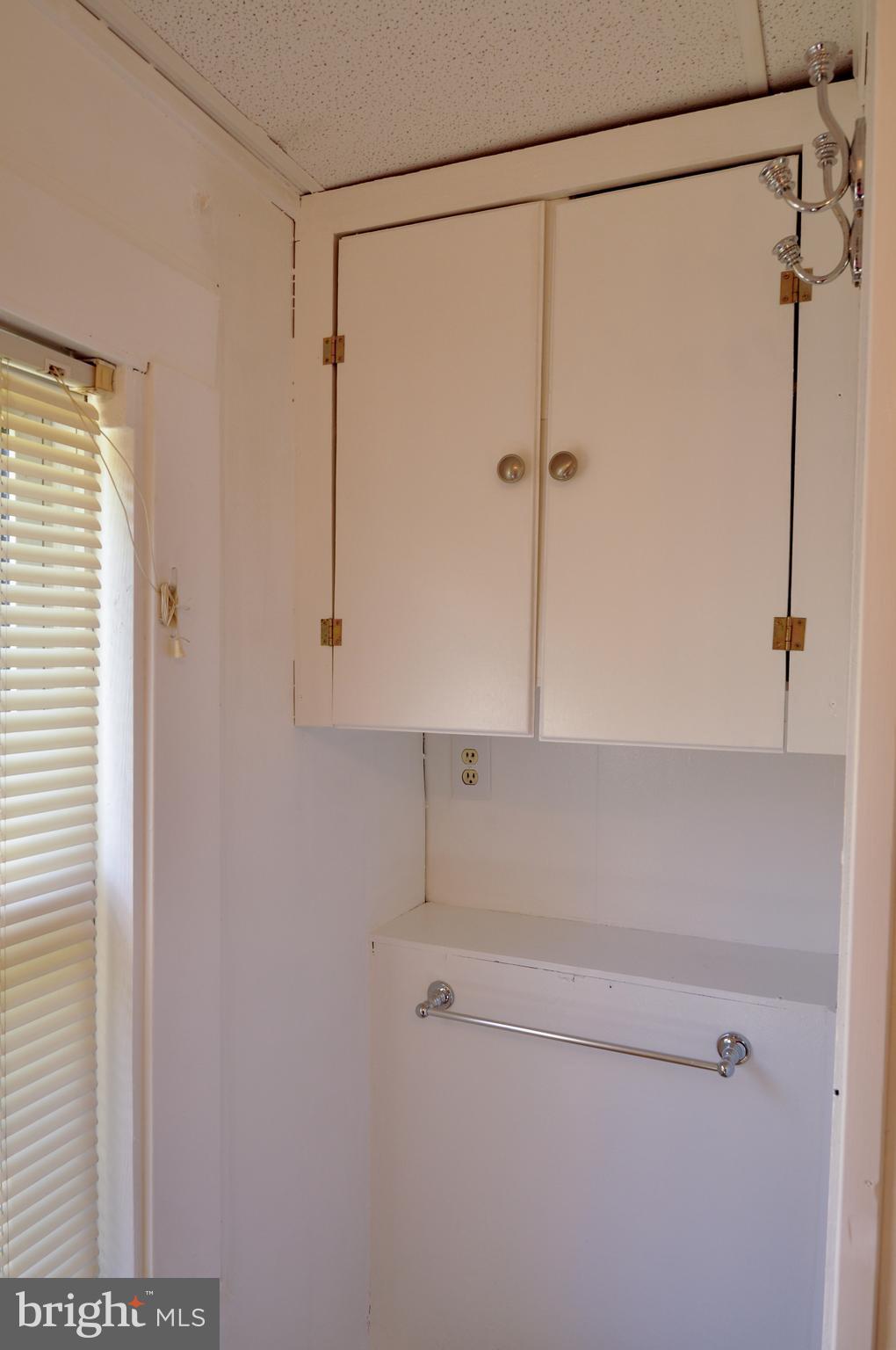 216 Clyde Avenue Baltimore, MD 21227 - Photo 37 of 64 Main Level Bathroom Cabinetry