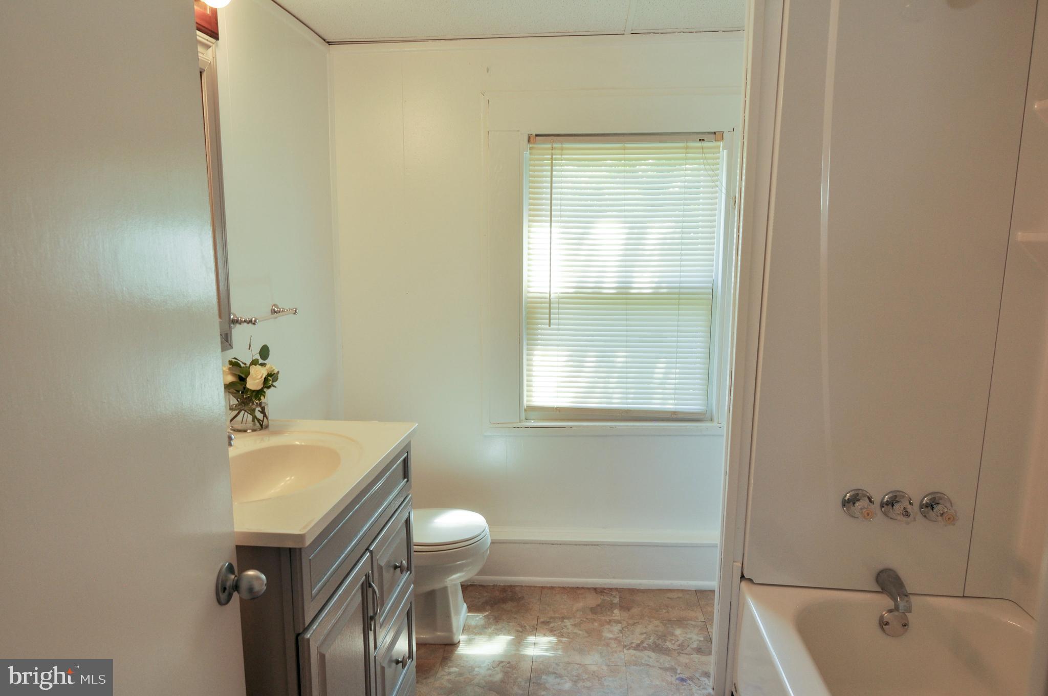 216 Clyde Avenue Baltimore, MD 21227 - Photo 38 of 64 Main Level Bathroom with New Flooring