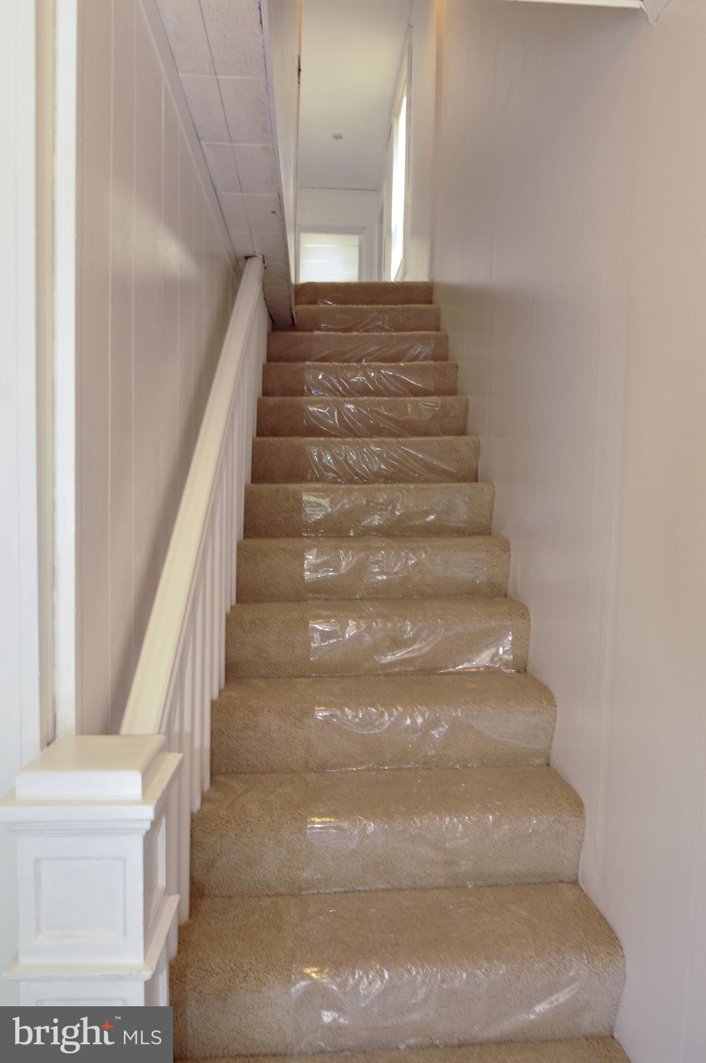 216 Clyde Avenue Baltimore, MD 21227 - Photo 39 of 64 Staircase Leading to the Second Level