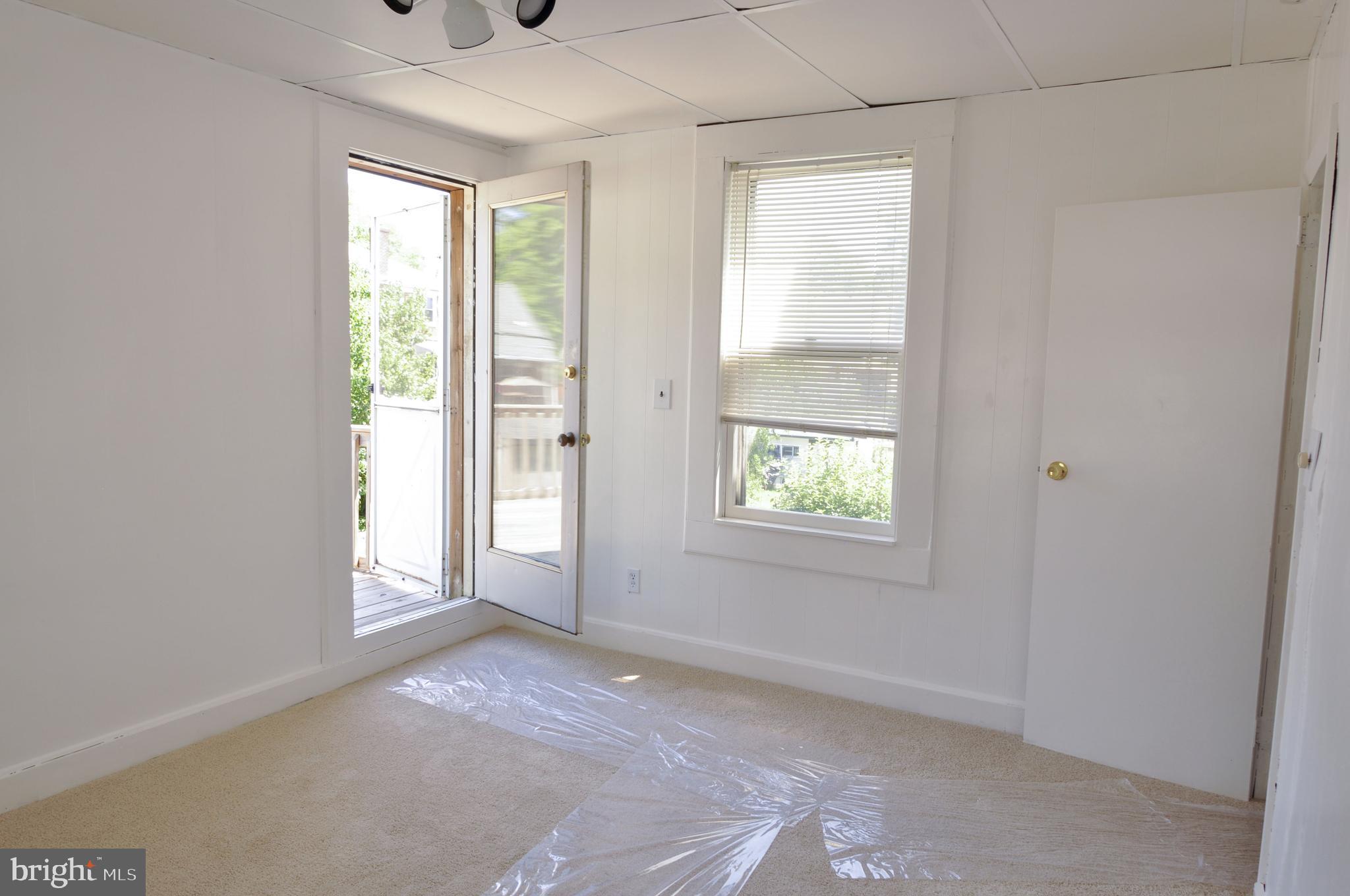 216 Clyde Avenue Baltimore, MD 21227 - Photo 53 of 64 Second Level Rear Bedroom / Walkout to Large Deck