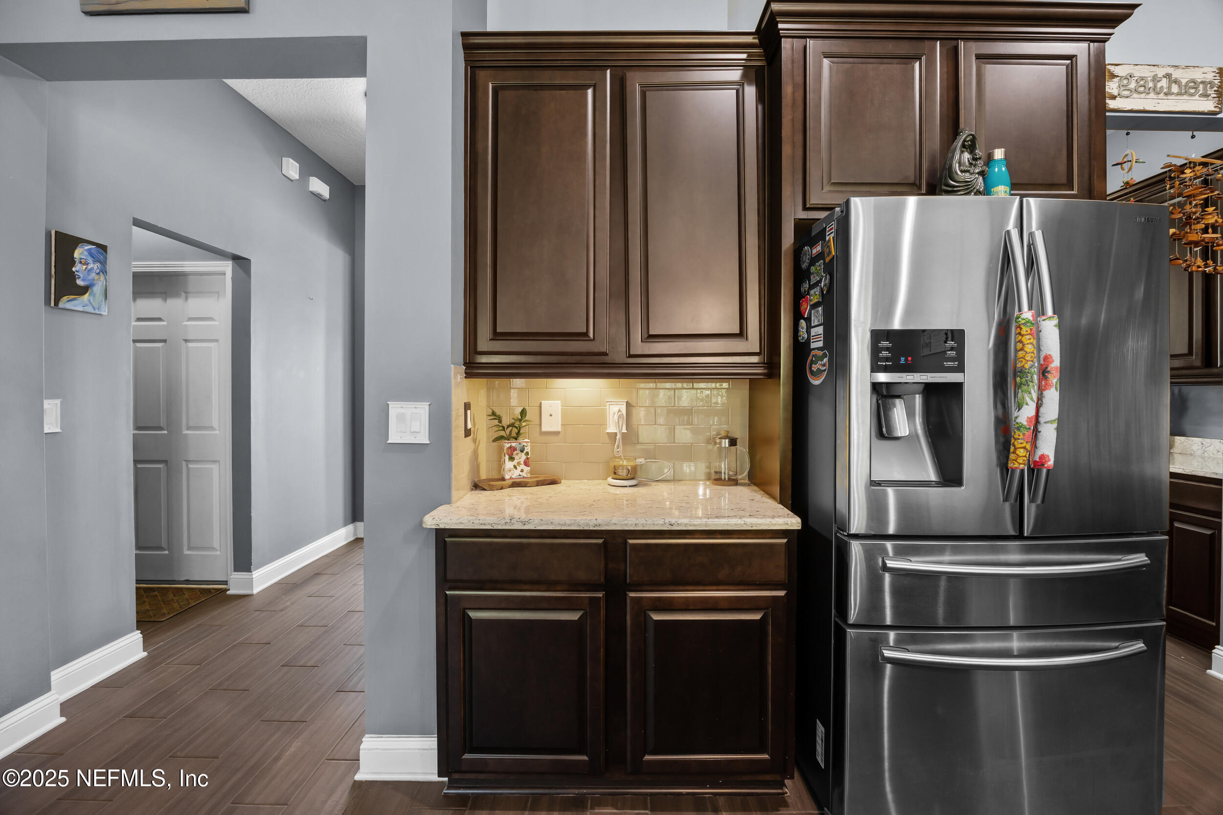 45 Oban Court St. Johns, FL 32259 - Photo 15 of 53 a kitchen with metallic refrigerator and microwave