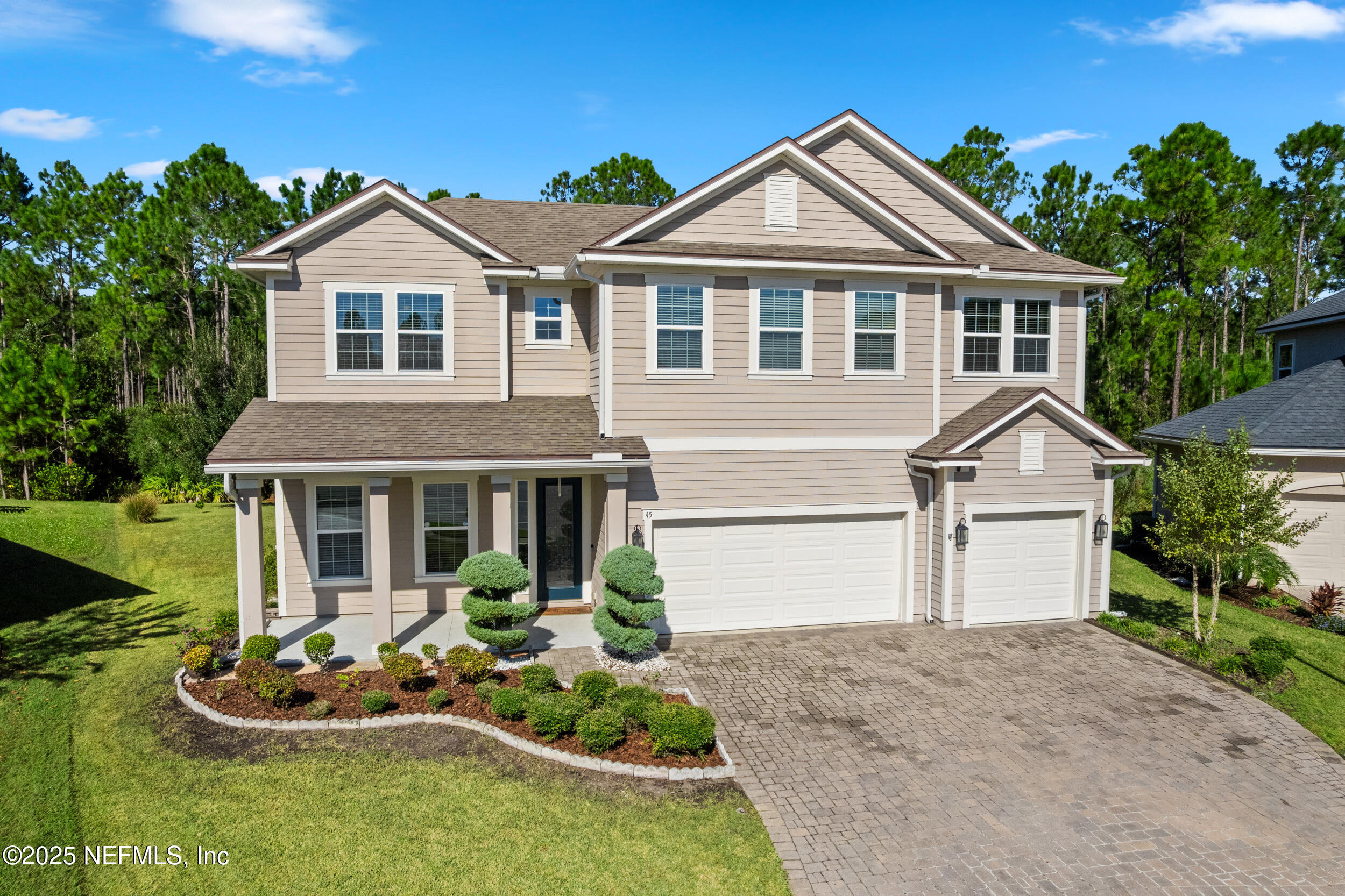 45 Oban Court St. Johns, FL 32259 - Photo 2 of 53 a front view of a house with a yard and garage