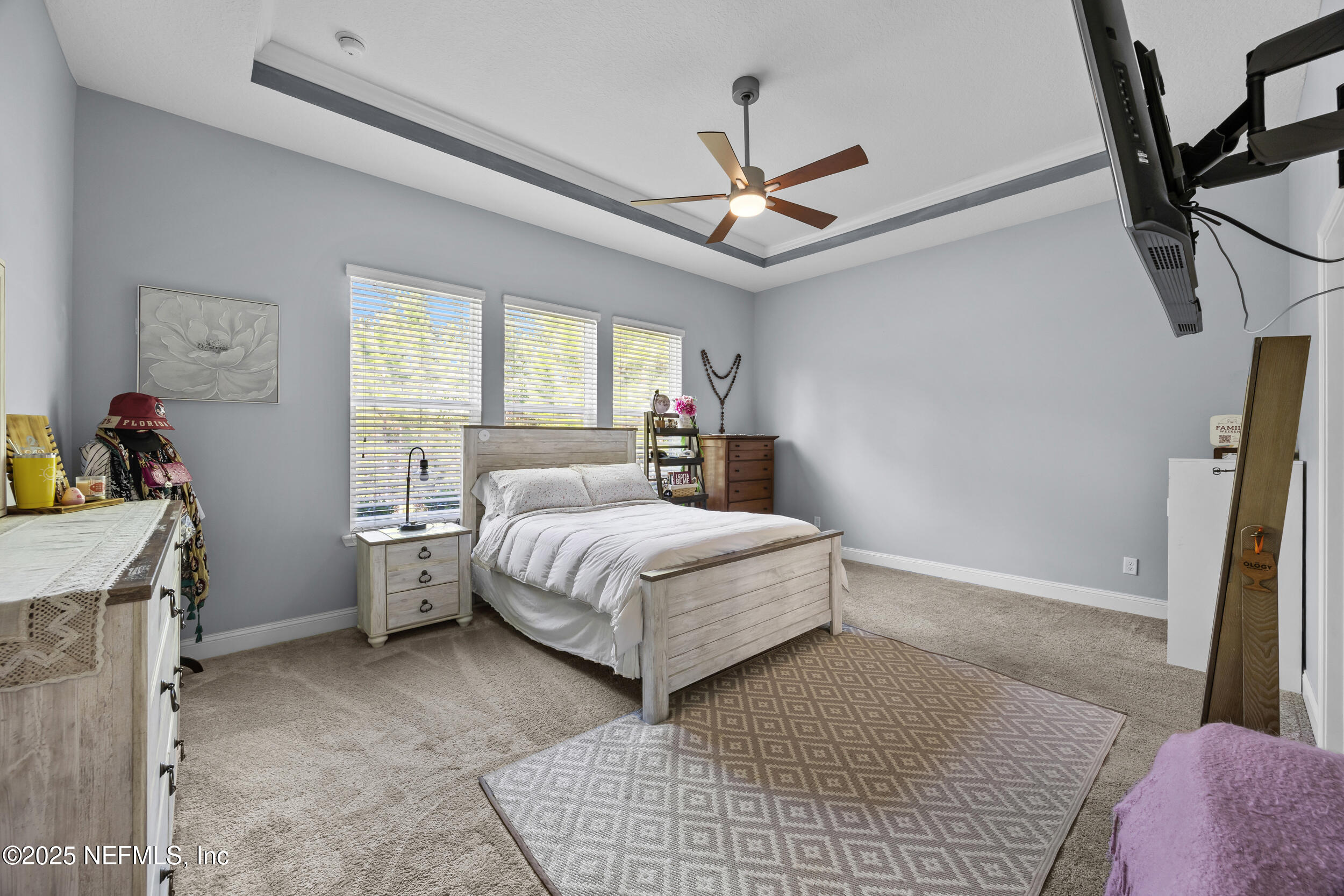 45 Oban Court St. Johns, FL 32259 - Photo 27 of 53 a bedroom with a bed and a chandelier