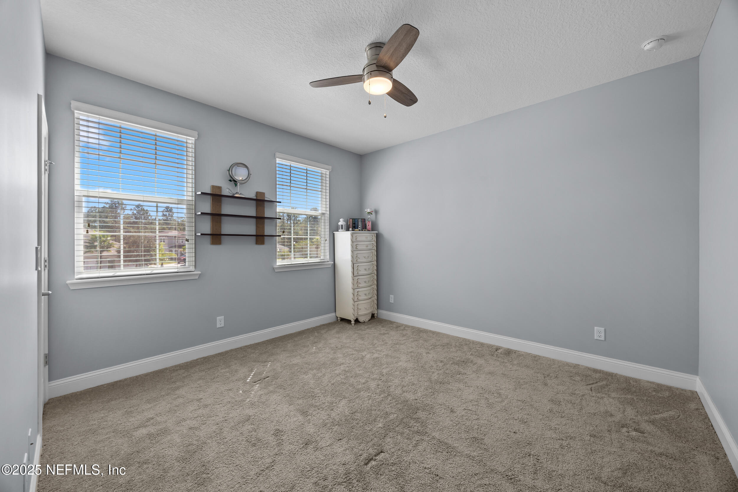 45 Oban Court St. Johns, FL 32259 - Photo 39 of 53 a view of a livingroom with a ceiling fan and window