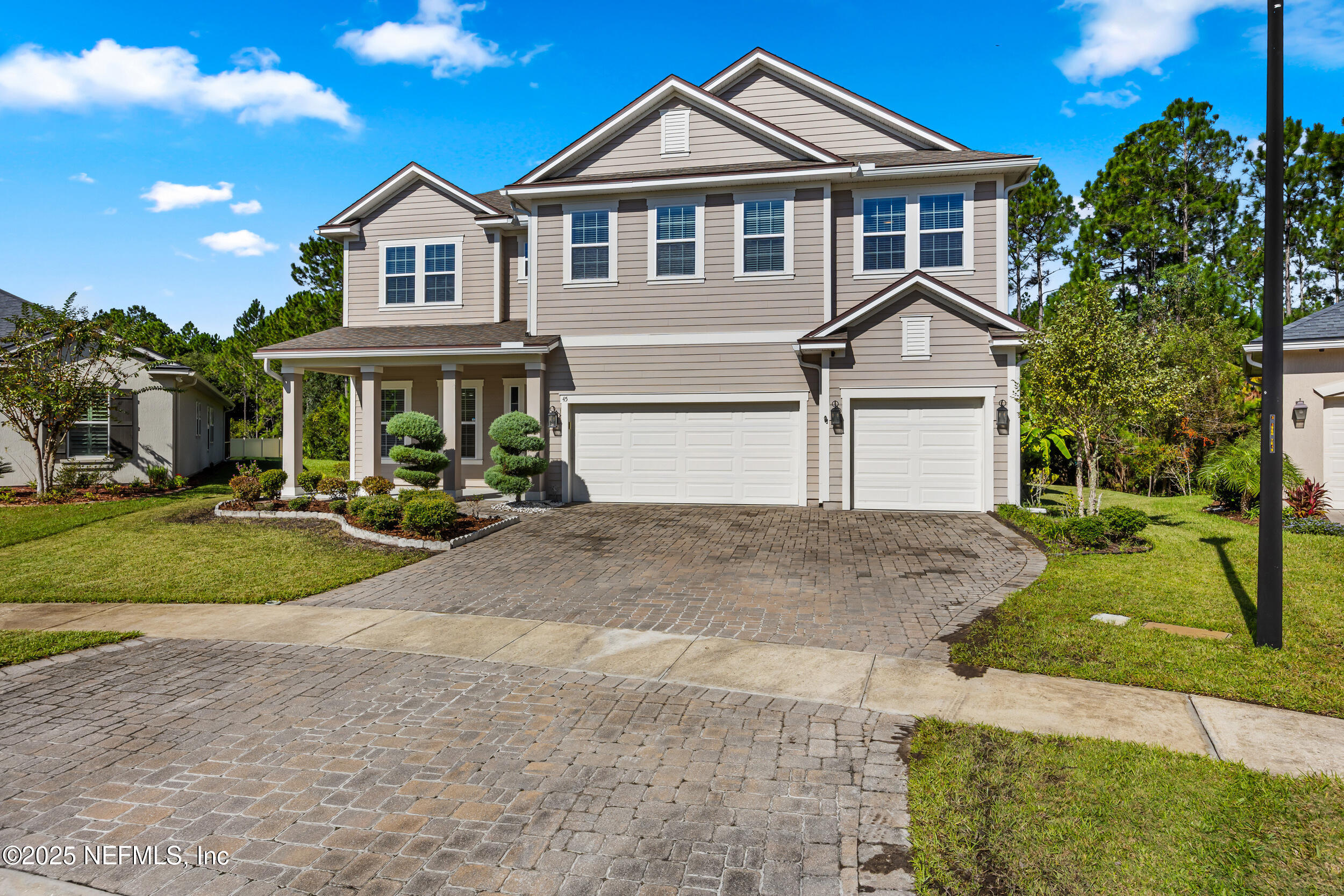 45 Oban Court St. Johns, FL 32259 - Photo 4 of 53 a front view of a house with a yard and garage
