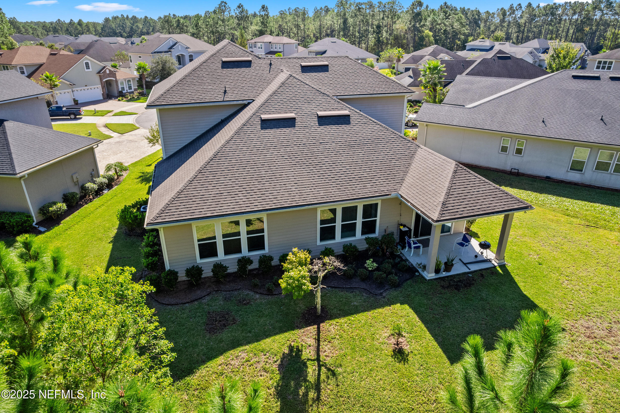 45 Oban Court St. Johns, FL 32259 - Photo 49 of 53 an aerial view of a house with swimming pool and patio