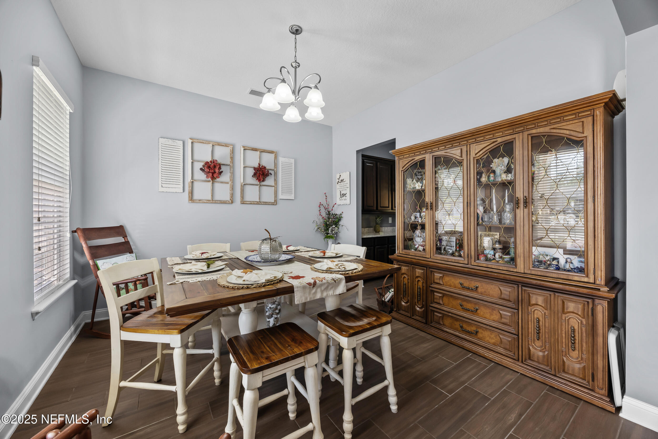 45 Oban Court St. Johns, FL 32259 - Photo 8 of 53 a view of a dining room with furniture a chandelier and wooden floor