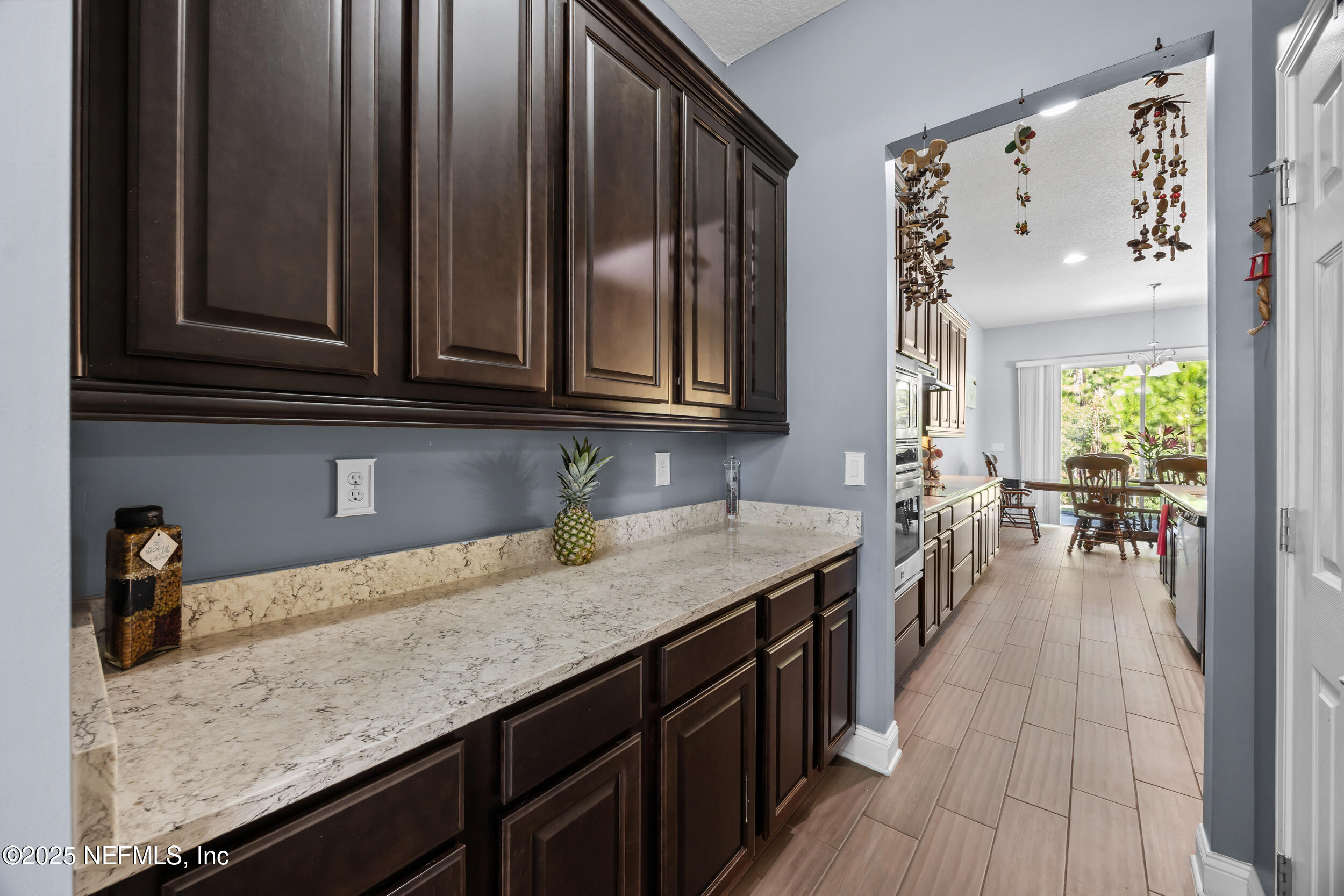 45 Oban Court St. Johns, FL 32259 - Photo 10 of 53 a kitchen with granite countertop a sink a stove and cabinets
