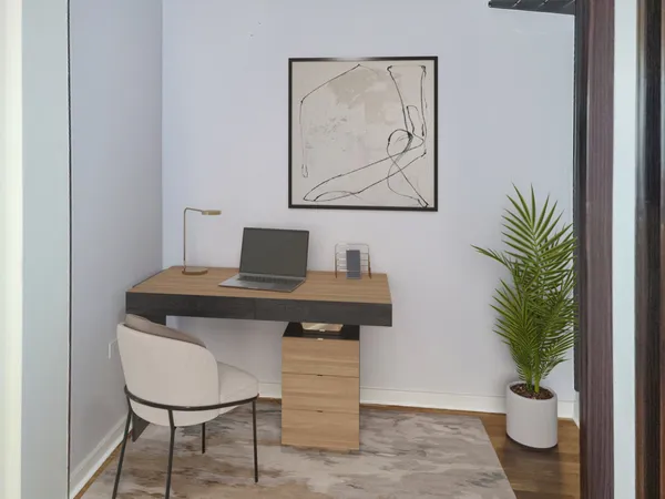 a view of a workspace with furniture