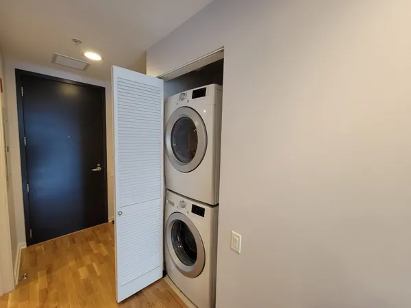 a view of a hallway with washer and dryer