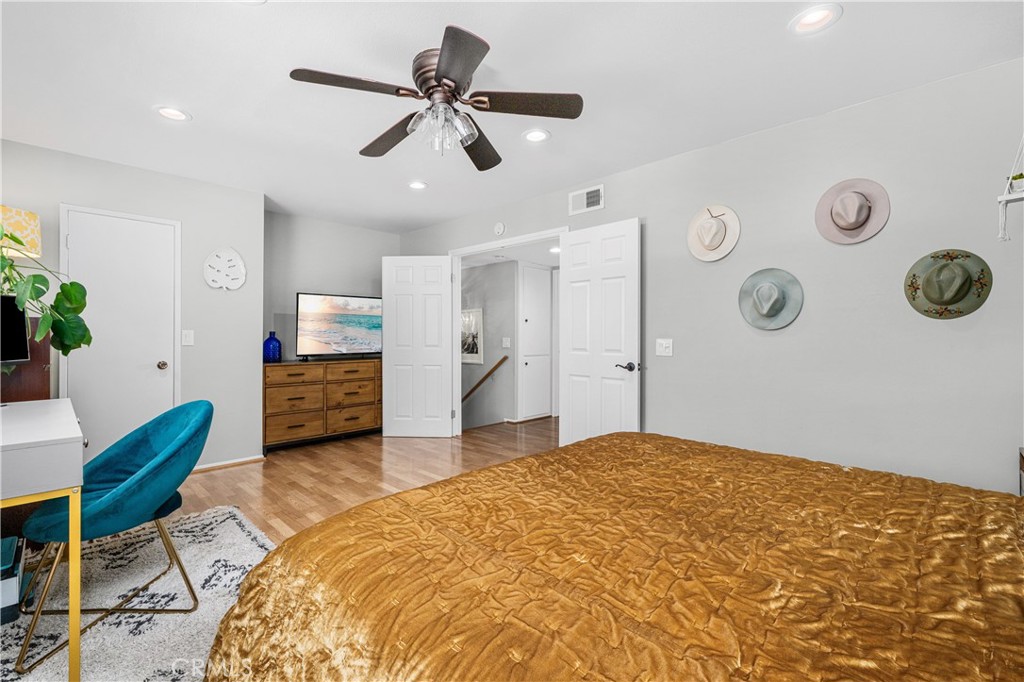 4237 Larwin Avenue Cypress, CA 90630 - Photo 24 of 48 a bedroom with furniture and a large window