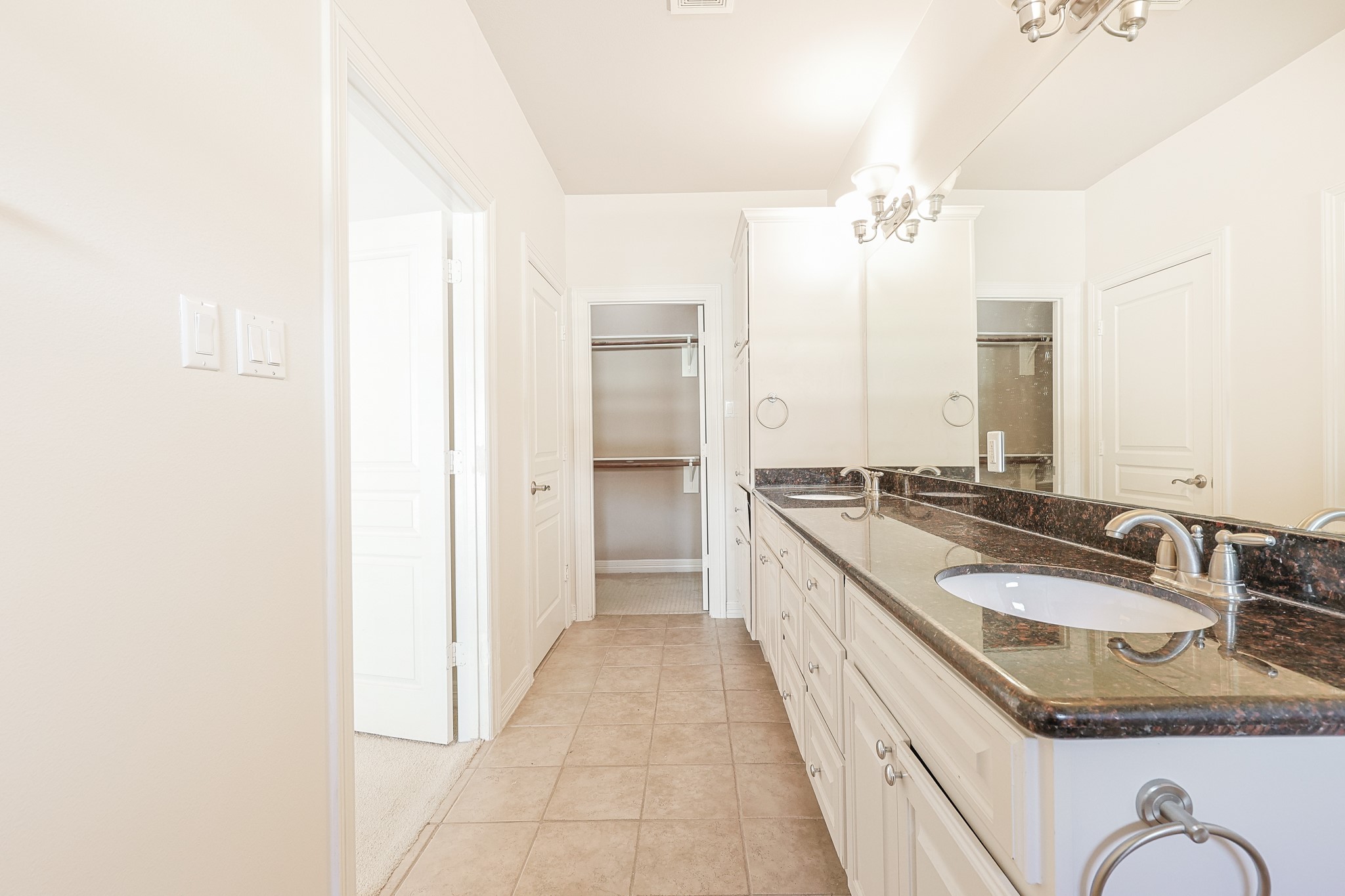 2540 Prospect Street, Unit C Houston, TX 77004 - Photo 20 of 31 a en suite bathroom with a granite countertop sink and a mirror