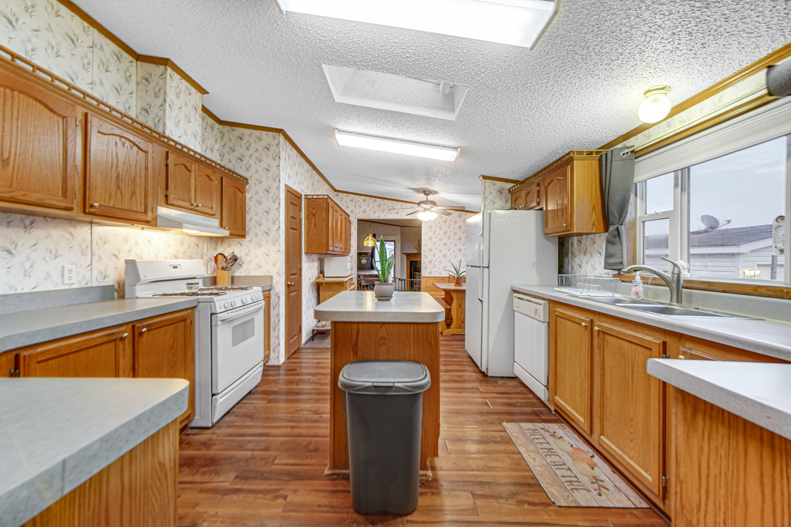 9 Swallow Lane Beecher, IL 60401 - Photo 13 of 24 a kitchen with stainless steel appliances granite countertop a stove a sink dishwasher and a refrigerator