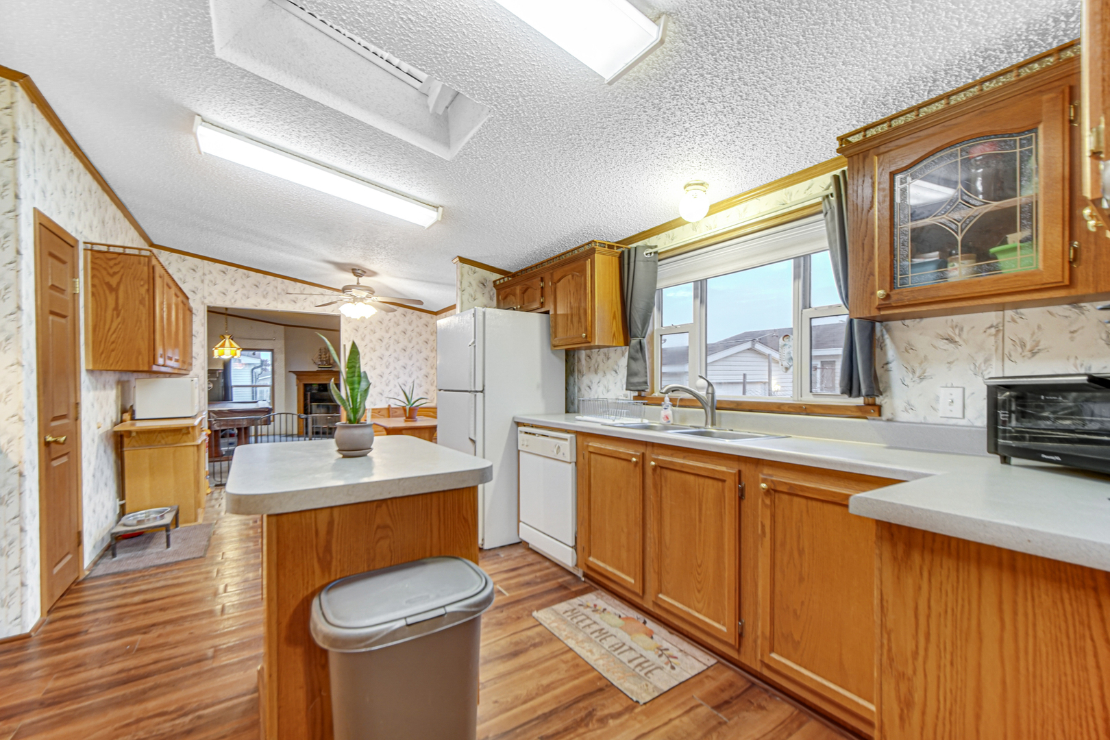 9 Swallow Lane Beecher, IL 60401 - Photo 15 of 24 a large kitchen with stainless steel appliances granite countertop a sink stove and wooden cabinets