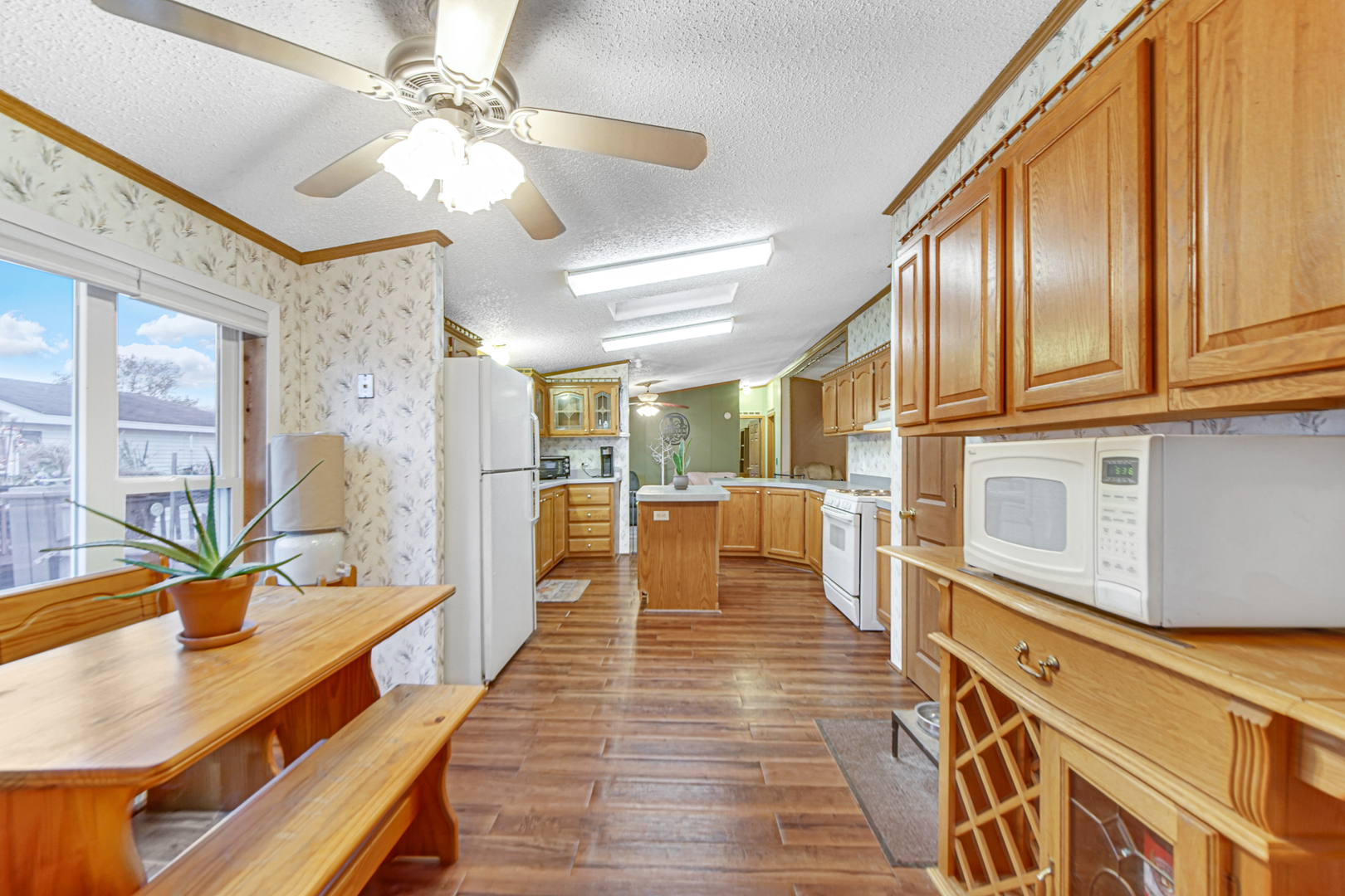 9 Swallow Lane Beecher, IL 60401 - Photo 17 of 24 a large kitchen with stainless steel appliances granite countertop a lot of counter space and a wooden floors