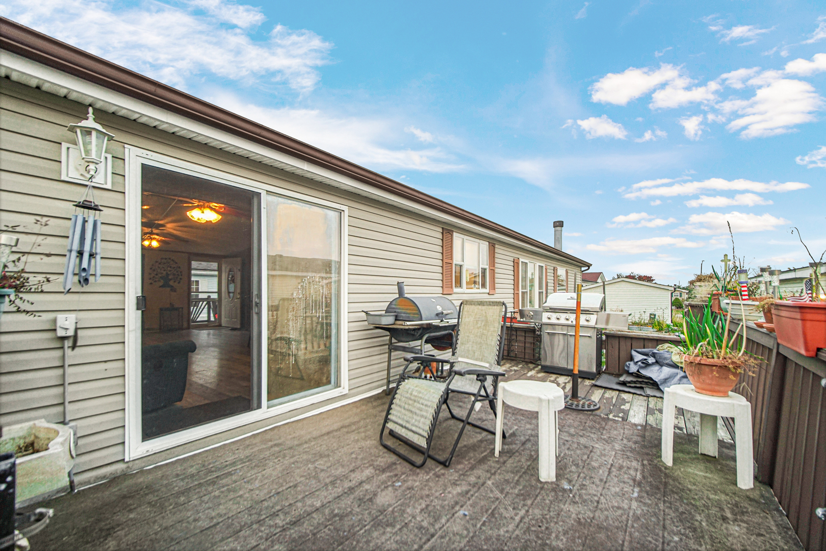 9 Swallow Lane Beecher, IL 60401 - Photo 3 of 24 a view of a patio with table and chairs and potted plants