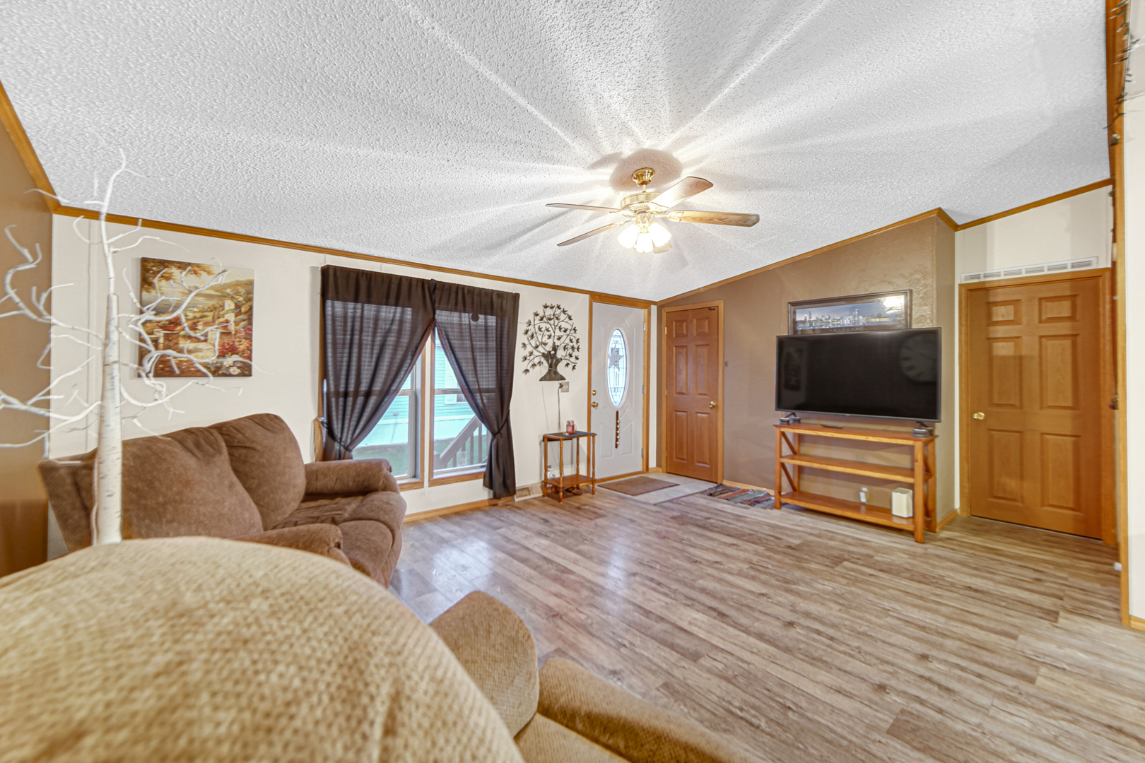 9 Swallow Lane Beecher, IL 60401 - Photo 5 of 24 a living room with furniture and a flat screen tv