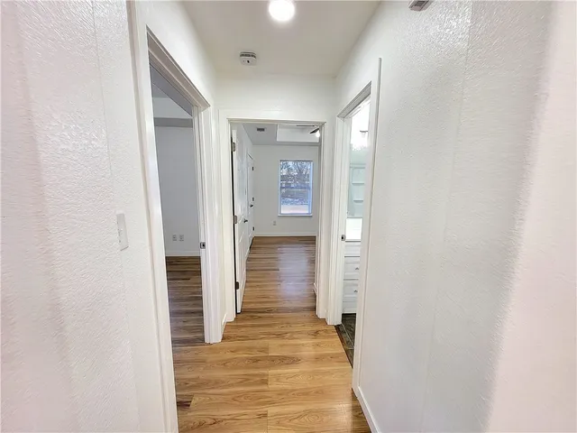 a view of kitchen with sink and wooden floor
