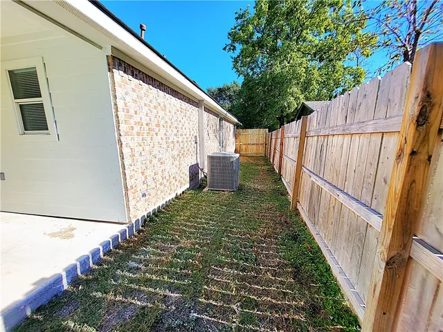 a view of balcony with wooden floor and fence