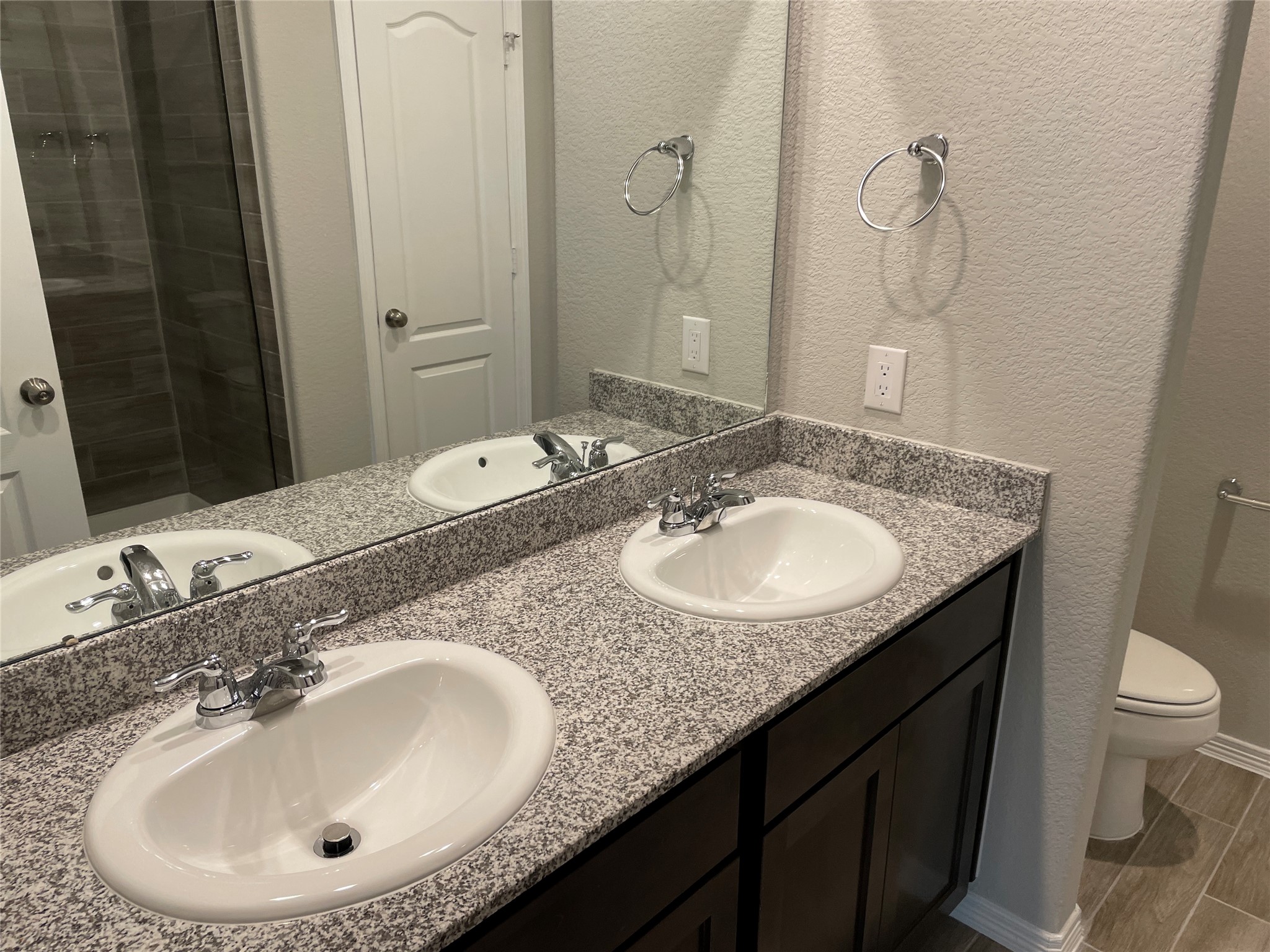 822 Redinger Ridge Drive Houston, TX 77336 - Photo 11 of 21 a bathroom with a granite countertop sink and a mirror