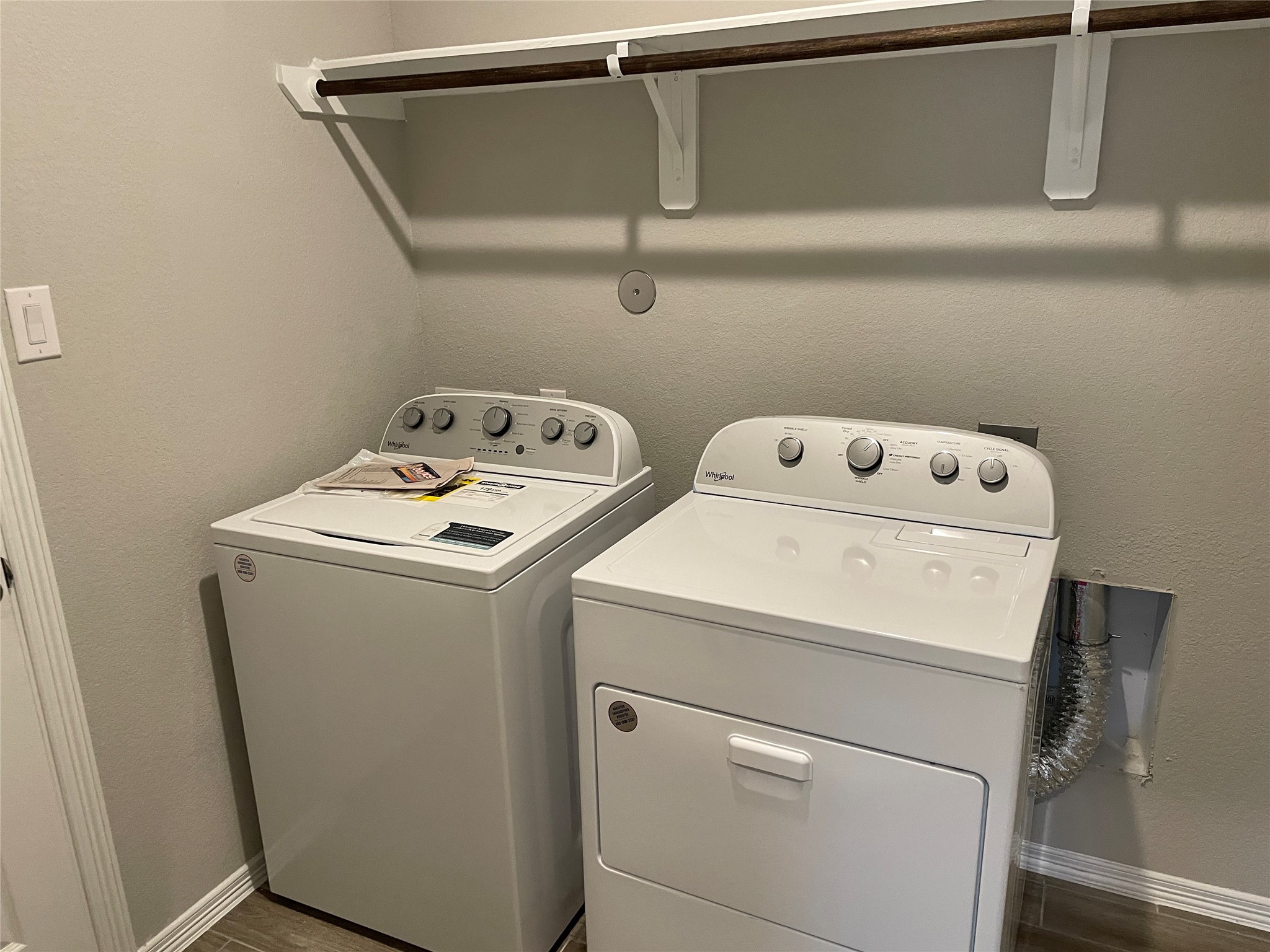 822 Redinger Ridge Drive Houston, TX 77336 - Photo 13 of 21 a utility room with dryer and washer