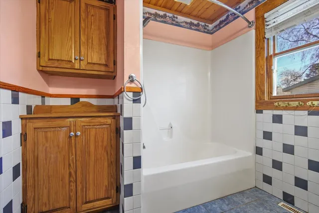 a bathroom with a sink toilet and mirror