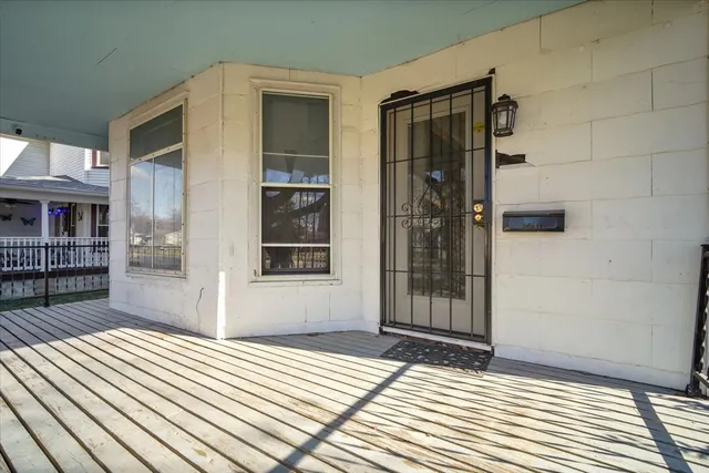 a view of an entryway with wooden floor