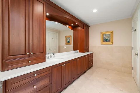 a bathroom with a double vanity sink and a mirror