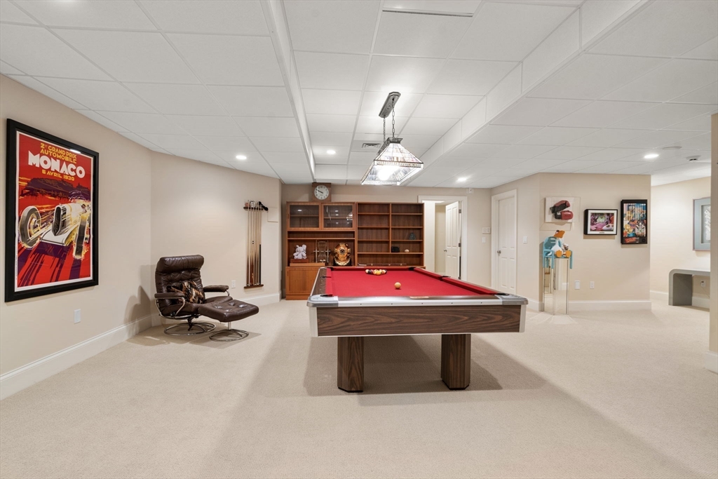 15 Rockport Road Weston, MA 02493 - Photo 17 of 20 a room with furniture and a flat screen tv