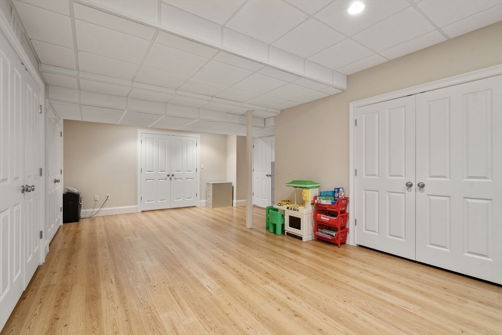 15 Rockport Road Weston, MA 02493 - Photo 18 of 20 a room with wooden floor and furniture