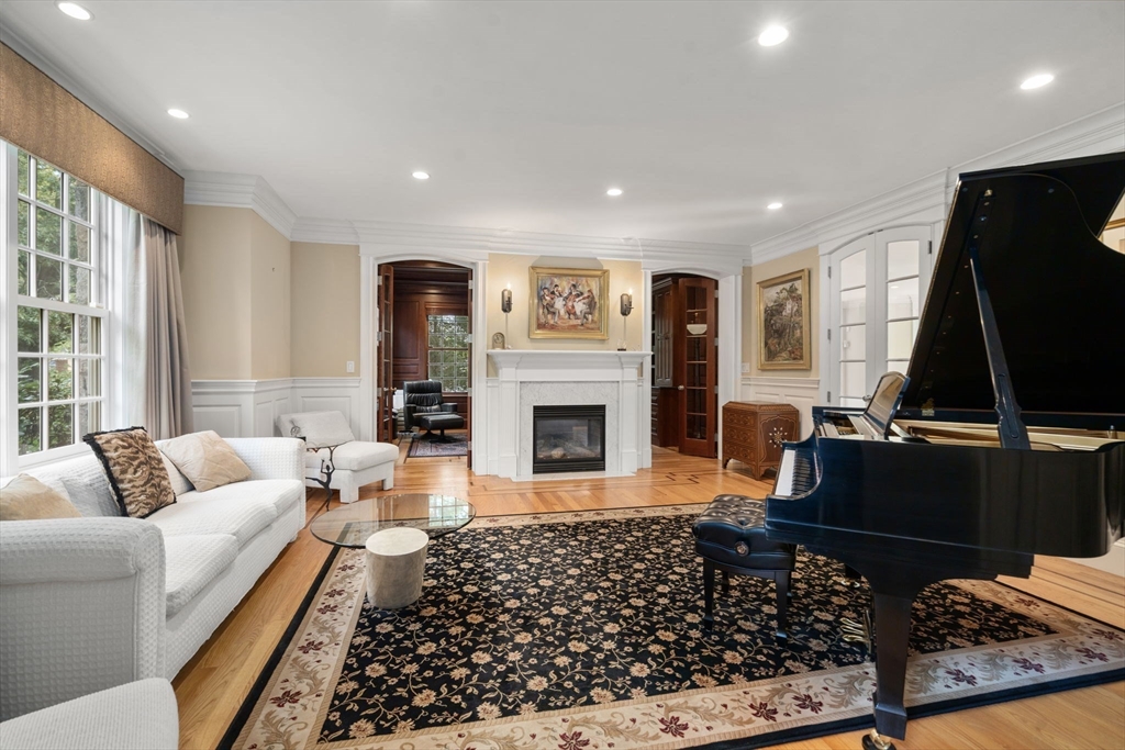 15 Rockport Road Weston, MA 02493 - Photo 2 of 20 a living room with furniture a flat screen tv and a fireplace