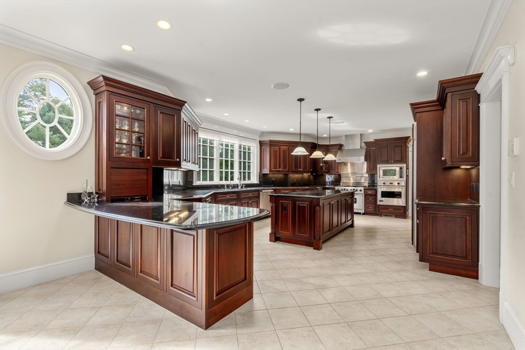 15 Rockport Road Weston, MA 02493 - Photo 6 of 20 a kitchen with stainless steel appliances granite countertop a stove and a refrigerator