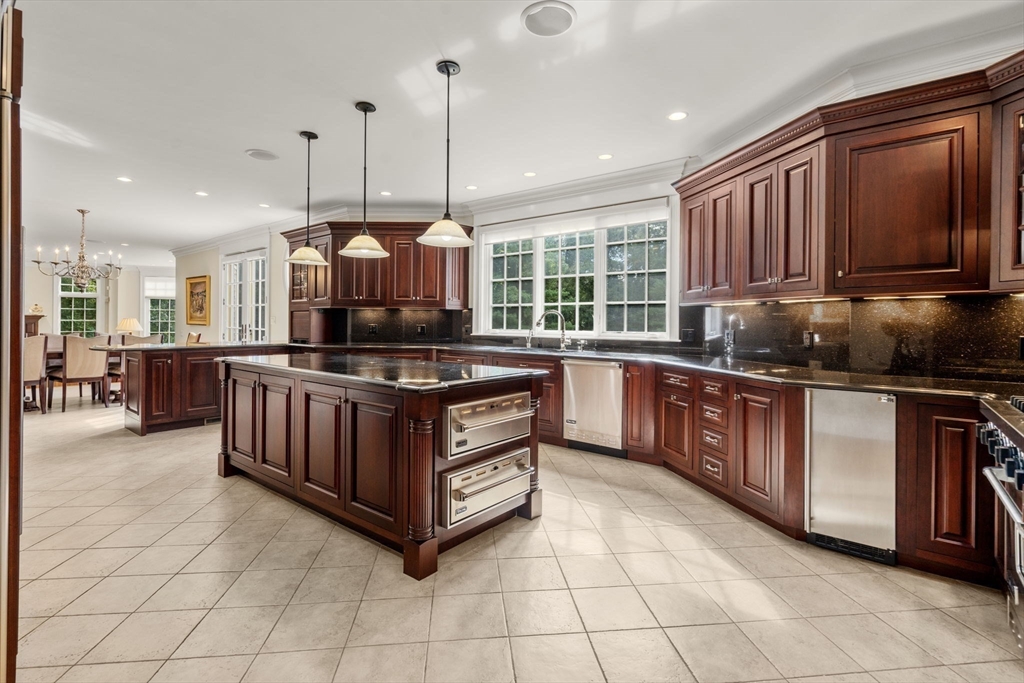 15 Rockport Road Weston, MA 02493 - Photo 7 of 20 a kitchen with stainless steel appliances granite countertop a stove a sink and a microwave