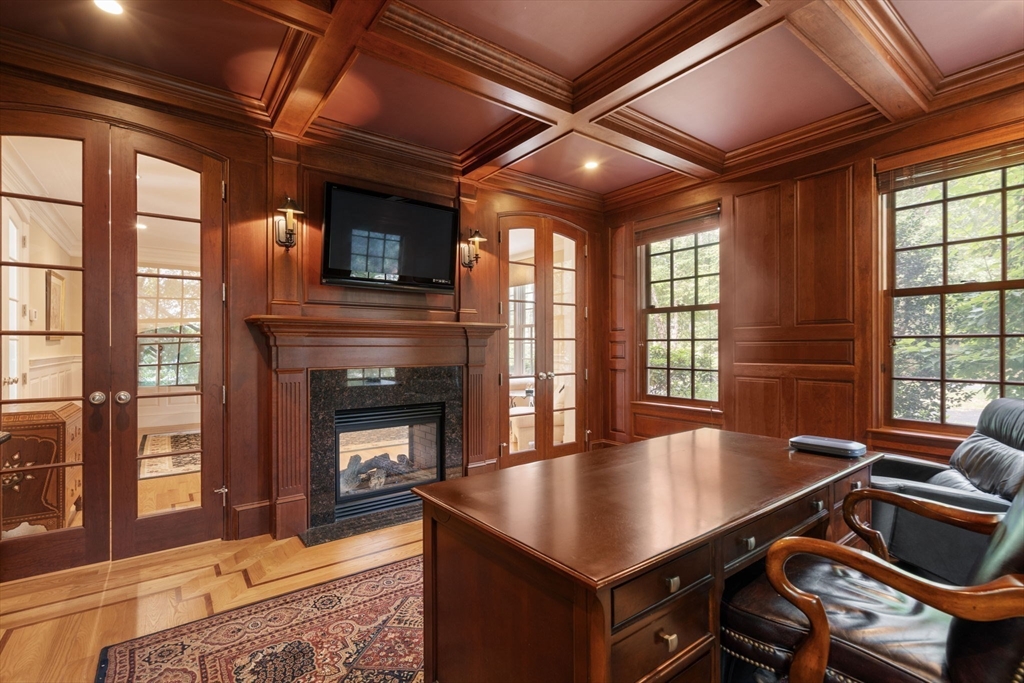 15 Rockport Road Weston, MA 02493 - Photo 9 of 20 a living room with furniture pool table wooden floor and a fireplace