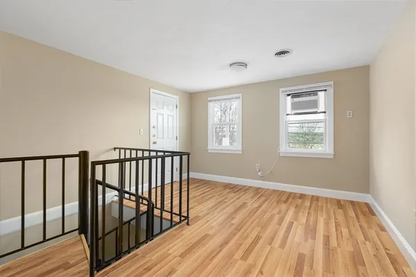 a view of hallway with windows