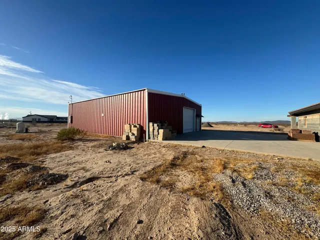 a view of a backyard of a house