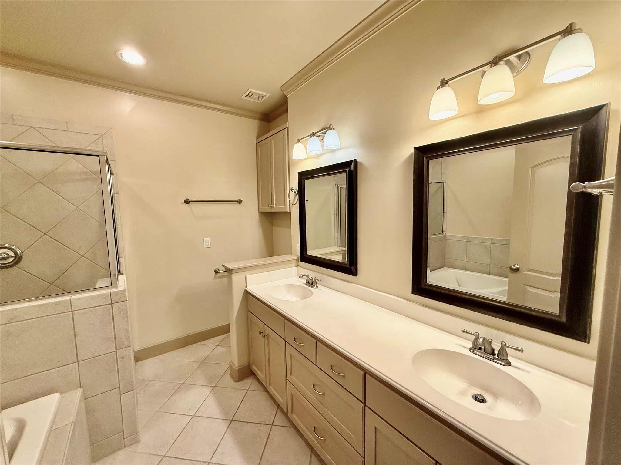 953 Yale Street, Unit 1 Houston, TX 77008 - Photo 17 of 24 a bathroom with a double vanity sink mirror and double