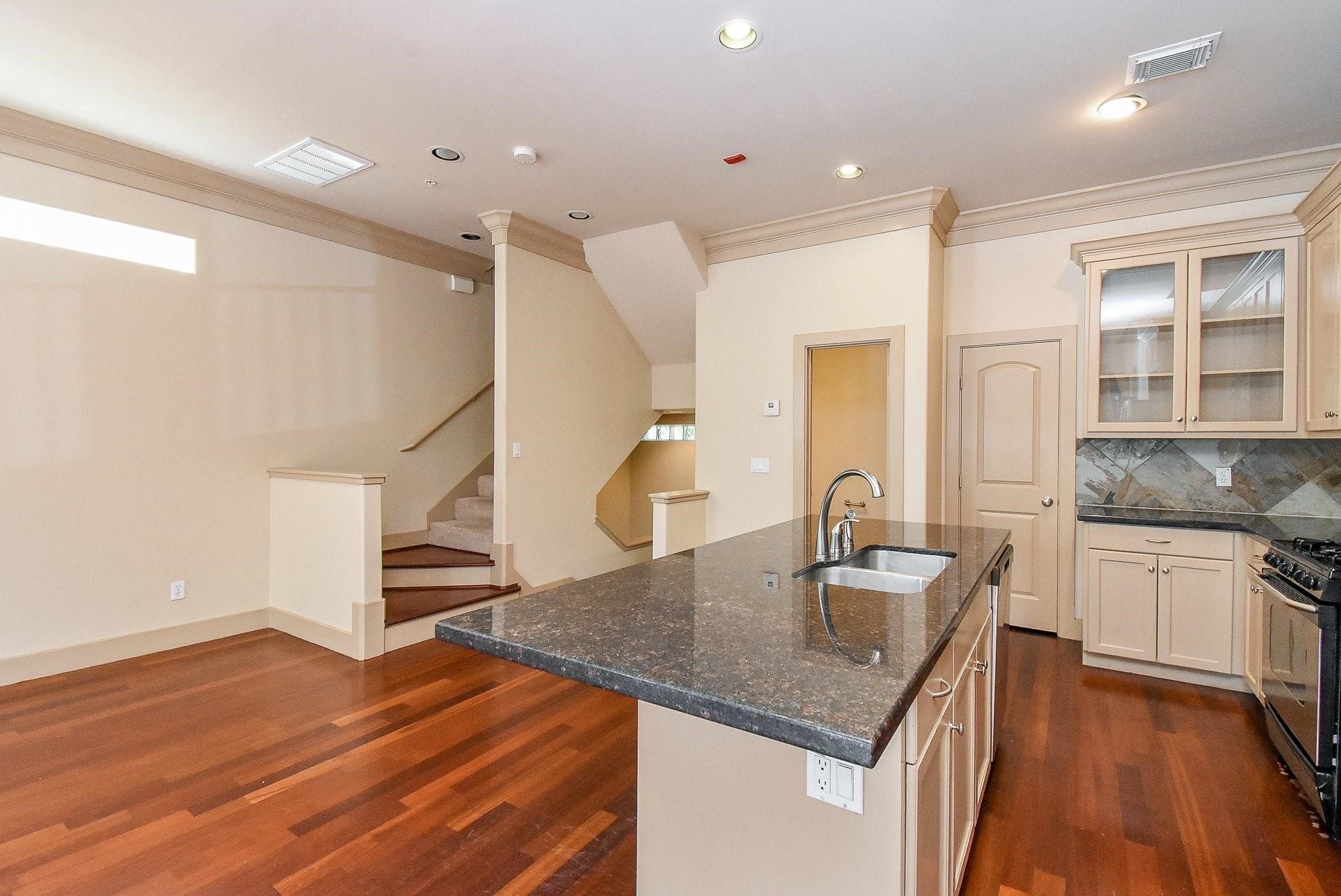 953 Yale Street, Unit 1 Houston, TX 77008 - Photo 6 of 24 Second floor living area with hardwood floors, high ceilings, gas fireplace and more.