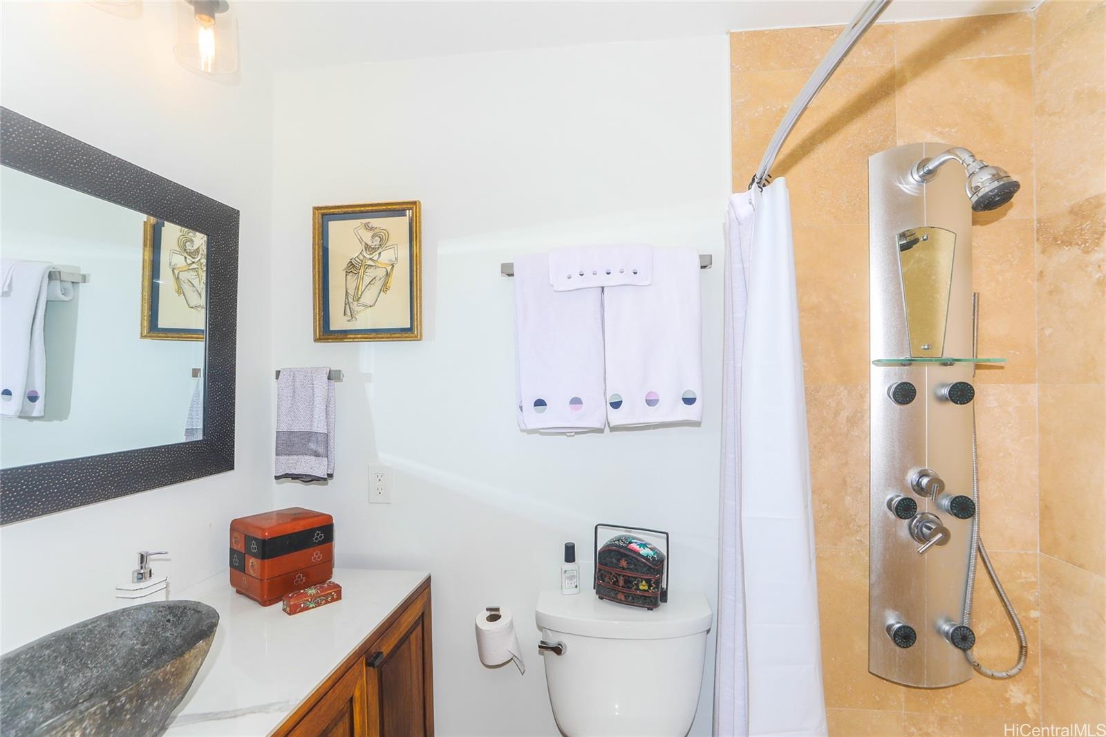 444 Lunalilo Home Road, Unit 312 Honolulu, HI 96825 - Photo 21 of 25 a bathroom with a sink toilet and shower