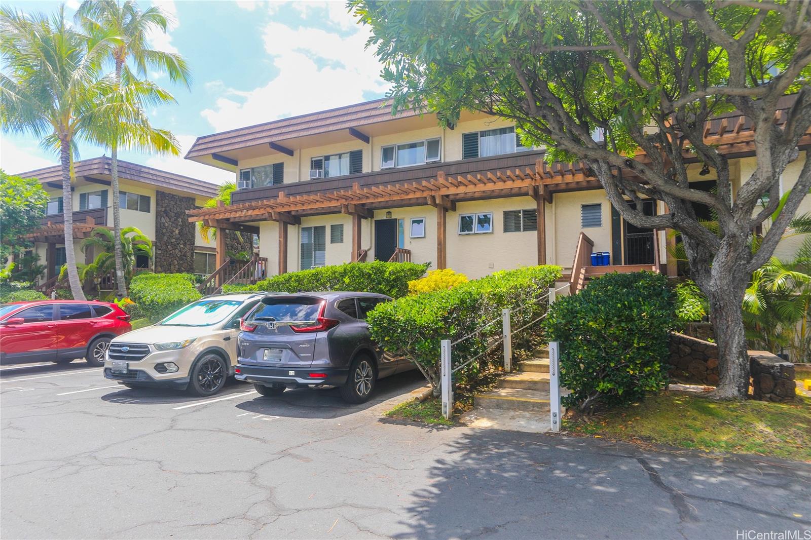444 Lunalilo Home Road, Unit 312 Honolulu, HI 96825 - Photo 23 of 25 a front view of a house with a garden
